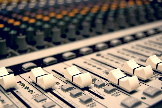 Jingle competition mixing desk image by Kristin Smith (via Shutterstock).
